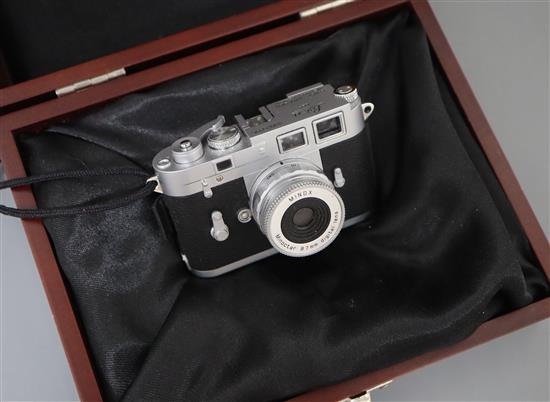 A cased Minox Leica miniature camera, a Minox glass, Contax 1 and a Minox Classic Leica III (3)
